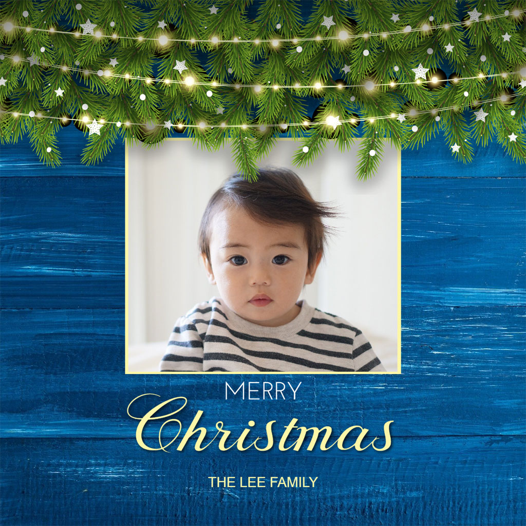 Christmas card with a baby boy in a striped shirt