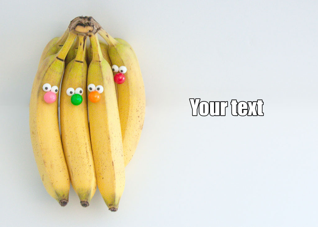 Bunch of bananas with candy eyes and noses