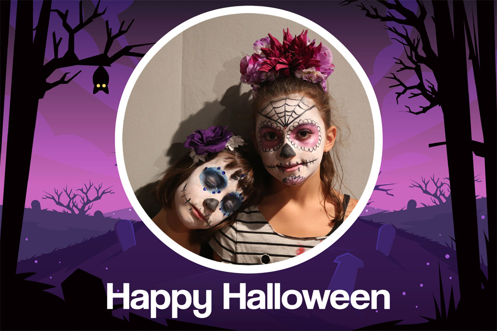 Girl dressed in sugar skull costume holding a dog