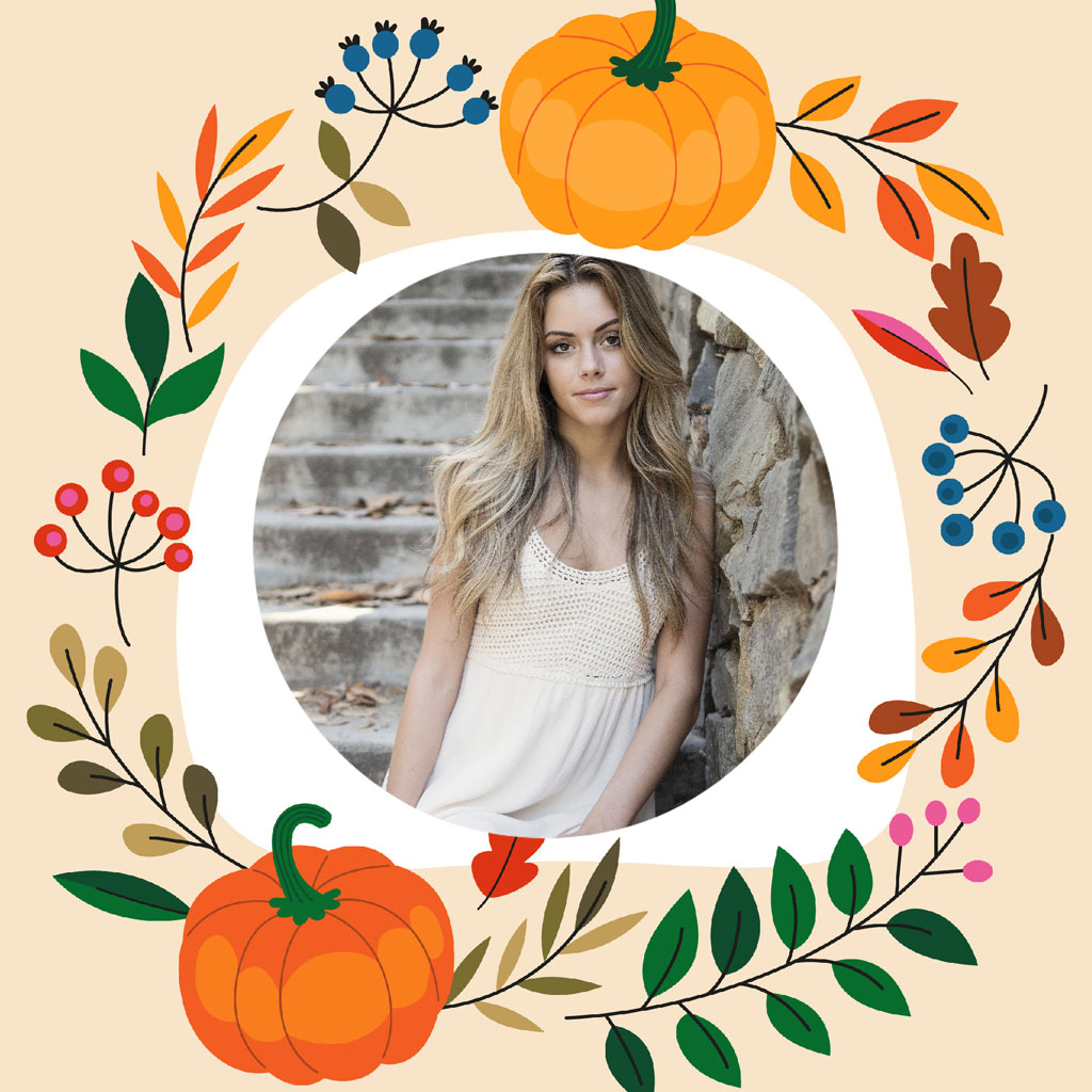 A young woman with long blonde hair in a white dress surrounded by autumn leaves and pumpkins.