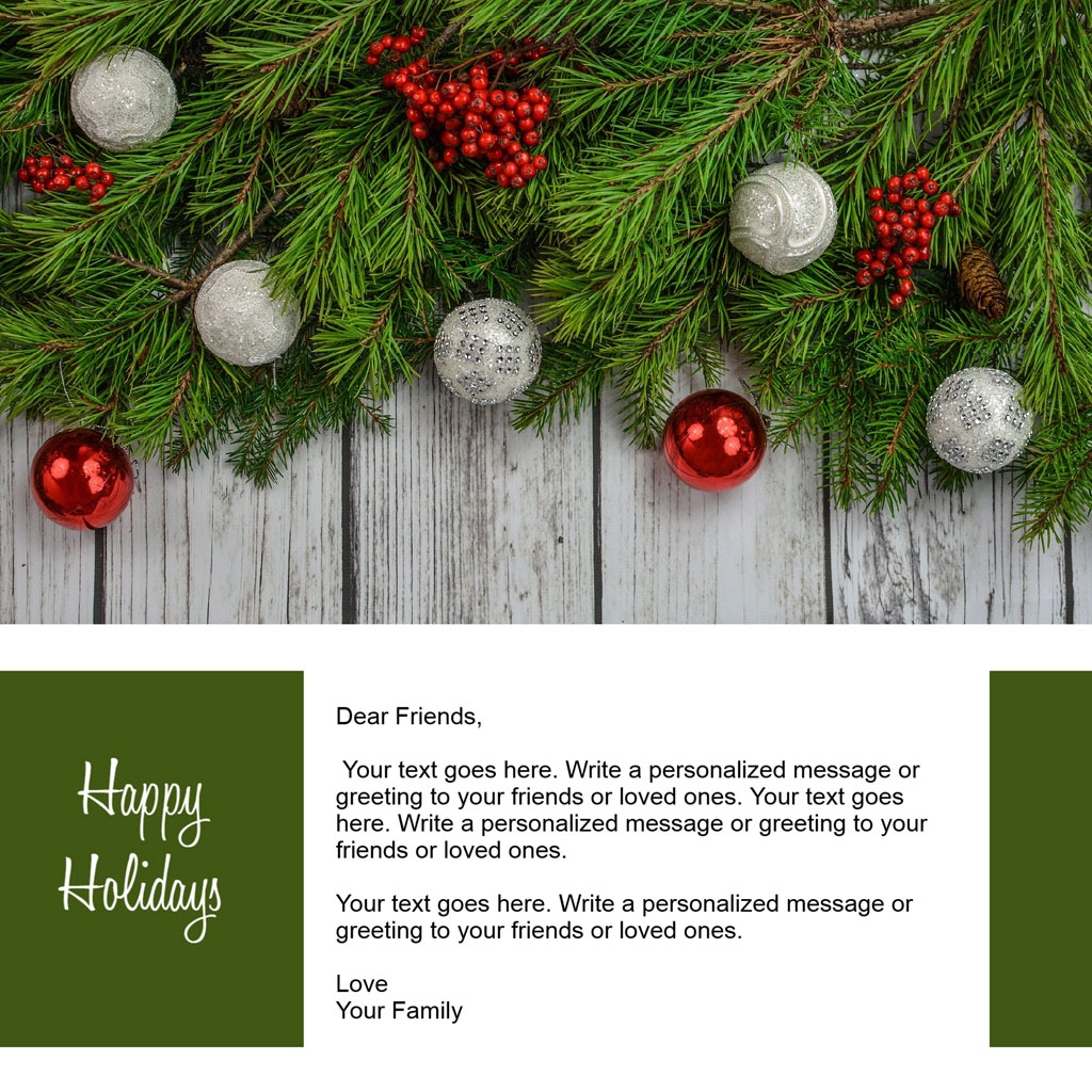 Holiday greeting card template with pine branches and ornaments on a wooden background