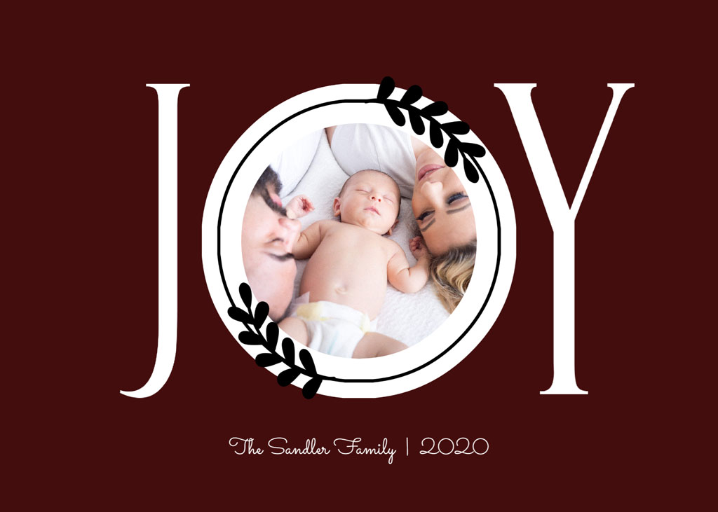 A mother and baby in a circular frame with 'JOY' on a dark red background