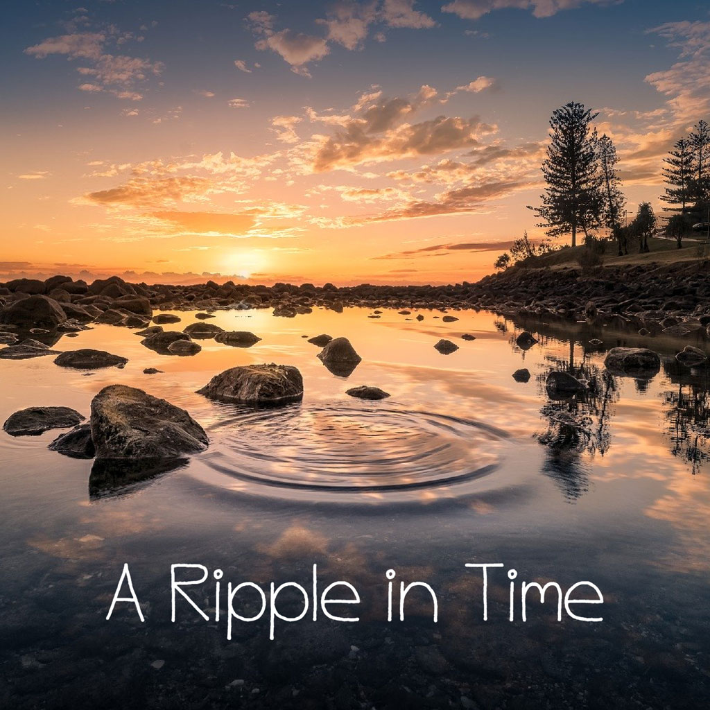 A serene sunset scene with a ripple in the water, surrounded by rocks and trees