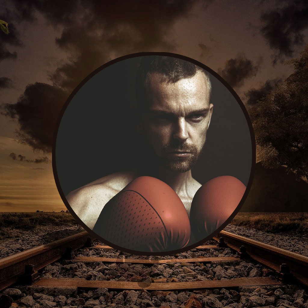 Boxer with gloves on train tracks