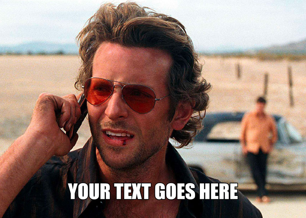 Man talking on phone in desert with another man standing by a car